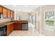 Bright kitchen featuring a stainless steel dishwasher and views of the backyard at 2708 Smithfield Dr, Orlando, FL 32837