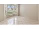 Bright living room featuring tile flooring and large windows offering views of the landscaped surroundings at 2708 Smithfield Dr, Orlando, FL 32837