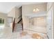 Inviting living room with staircase and tile floors at 2708 Smithfield Dr, Orlando, FL 32837