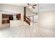 Open-concept living room with tile floors flows into the kitchen with wood cabinets and black appliances at 2708 Smithfield Dr, Orlando, FL 32837