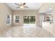 Bright, tiled living room with sliding glass doors to the outside at 2708 Smithfield Dr, Orlando, FL 32837