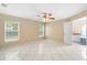 Large main bedroom with tile floors, ceiling fan and access to an en suite bathroom at 2708 Smithfield Dr, Orlando, FL 32837