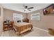 Comfortable bedroom with ceiling fan, natural light, and a warm, inviting ambiance at 2720 Kumquat Dr, Edgewater, FL 32141