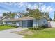 Stylish single story home boasts a tidy lawn and inviting front entrance at 2720 Kumquat Dr, Edgewater, FL 32141