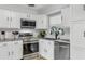 Modern kitchen features stainless steel appliances and a subway tile backsplash at 2720 Kumquat Dr, Edgewater, FL 32141