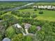 A breathtaking aerial showcases a home with solar panels, with the river and lush nature surrounding the property at 2770 Red Wing Vlg, Deland, FL 32720