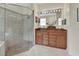 Well-lit bathroom featuring a glass-enclosed shower and vanity with beautiful marble countertops at 2770 Red Wing Vlg, Deland, FL 32720