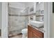 Modern bathroom features a frameless glass shower and a stylish vessel sink on a granite counter at 2770 Red Wing Vlg, Deland, FL 32720