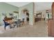 Spacious dining area with travertine floors, a piano, and seamless flow to the kitchen and other living areas at 2770 Red Wing Vlg, Deland, FL 32720