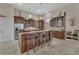 Gourmet kitchen with stainless steel appliances, custom cabinetry, and a large island at 2770 Red Wing Vlg, Deland, FL 32720
