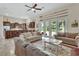 Spacious living room with neutral tones, natural light, and an open floorplan to the kitchen at 2770 Red Wing Vlg, Deland, FL 32720