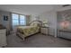 Bright bedroom with a floral-patterned bedspread and views of the city at 2800 N Atlantic Ave # 1716, Daytona Beach, FL 32118