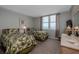 Bedroom featuring two beds with palm-leaf patterns and ocean views from the large window at 2800 N Atlantic Ave # 1716, Daytona Beach, FL 32118
