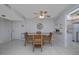 Dining room with a glass table, seating for four, and open access to the kitchen at 2800 N Atlantic Ave # 1716, Daytona Beach, FL 32118