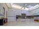 Well-lit kitchen with white cabinets, modern appliances, and a breakfast bar at 2800 N Atlantic Ave # 1716, Daytona Beach, FL 32118
