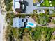 Aerial view of an oceanfront estate featuring a private pool, putting green, and beach access at 2833 S Atlantic Ave, Daytona Beach, FL 32118