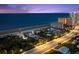 Stunning aerial view of beachfront homes along the ocean, with an arrow pointing to a specific property at 2833 S Atlantic Ave, Daytona Beach, FL 32118