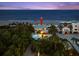 Stunning aerial view of a beachfront home with a pool and lush landscaping at 2833 S Atlantic Ave, Daytona Beach, FL 32118