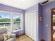 Relaxing bedroom features a chair and peaceful views from a large bright window at 2833 S Atlantic Ave, Daytona Beach, FL 32118
