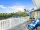 Inviting deck offers bright blue seating with views of lush surroundings at 2833 S Atlantic Ave, Daytona Beach, FL 32118
