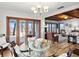 Dining area boasts a glass table and beach views, creating an ideal spot for meals at 2833 S Atlantic Ave, Daytona Beach, FL 32118