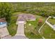 Expansive property featuring lush greenery and a charming single-story home with a well-manicured lawn at 2880 Boyd Ct, Deltona, FL 32738