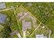 Survey lines show the perimeter of a property featuring a single-story home surrounded by lush greenery and trees at 2880 Boyd Ct, Deltona, FL 32738