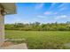 Spacious backyard with lush green grass and trees at 2880 Boyd Ct, Deltona, FL 32738
