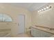 Well-lit bathroom featuring a corner tub, a large countertop, and a neutral color scheme at 2880 Boyd Ct, Deltona, FL 32738