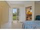 Bedroom with access to backyard patio and kitchen at 2880 Boyd Ct, Deltona, FL 32738