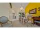Elegant dining room with chandelier, painting and view into tiled hallway at 2880 Boyd Ct, Deltona, FL 32738