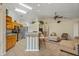 Open kitchen features wooden cabinets, stainless steel appliances, and seamless transition to living areas at 2880 Boyd Ct, Deltona, FL 32738