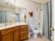 Well-lit bathroom with a shower-tub combo, updated vanity, and ample storage, maximizing functionality at 307 Ravenshill Way, Deland, FL 32724