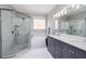 Elegant bathroom showcases a glass shower, soaking tub, and a large vanity, providing a spa-like experience at 307 Ravenshill Way, Deland, FL 32724