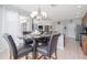 Bright breakfast nook adjoins the kitchen and offers backyard views, creating a cozy dining space at 307 Ravenshill Way, Deland, FL 32724