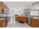 Bright, open kitchen features granite counters, stainless appliances, and a casual dining area, great for gatherings at 307 Ravenshill Way, Deland, FL 32724