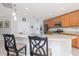 Modern kitchen featuring granite countertops, stainless steel appliances, and a convenient breakfast bar at 307 Ravenshill Way, Deland, FL 32724