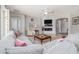 Cozy living room showcasing a large sectional sofa, a modern fireplace, and stylish decor at 307 Ravenshill Way, Deland, FL 32724