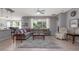 Spacious living room with tile floors, large windows for natural light, and comfortable seating arrangements at 307 Ravenshill Way, Deland, FL 32724