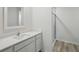 Bathroom featuring sleek single sink vanity and glass-enclosed shower at 3121 Canterbury St, Deltona, FL 32738