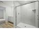 Bathroom featuring sleek glass-enclosed shower and single sink vanity at 3121 Canterbury St, Deltona, FL 32738