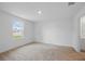 Cozy bedroom with a window, neutral carpet and natural light at 3121 Canterbury St, Deltona, FL 32738