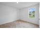 Bedroom with carpet flooring and a window that provides great natural light at 3121 Canterbury St, Deltona, FL 32738