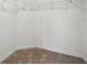 Walk-in closet features carpet and wire shelving at 3121 Canterbury St, Deltona, FL 32738
