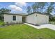Charming single-story home with a well-manicured lawn and a two-car garage at 3121 Canterbury St, Deltona, FL 32738