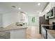 Modern kitchen featuring granite countertops, stainless steel appliances, and white cabinetry at 3121 Canterbury St, Deltona, FL 32738
