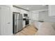 Contemporary kitchen with stainless steel appliances, granite counters, and white cabinets at 3121 Canterbury St, Deltona, FL 32738