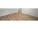 Spacious living room featuring wood-look flooring and neutral walls at 3121 Canterbury St, Deltona, FL 32738