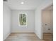 Versatile room with wood-style flooring and natural light, ready for customization at 3121 Canterbury St, Deltona, FL 32738