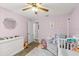Cozy bedroom with pastel walls, -friendly decor, and comfortable furnishings at 3132 Mango Tree Dr, Edgewater, FL 32141